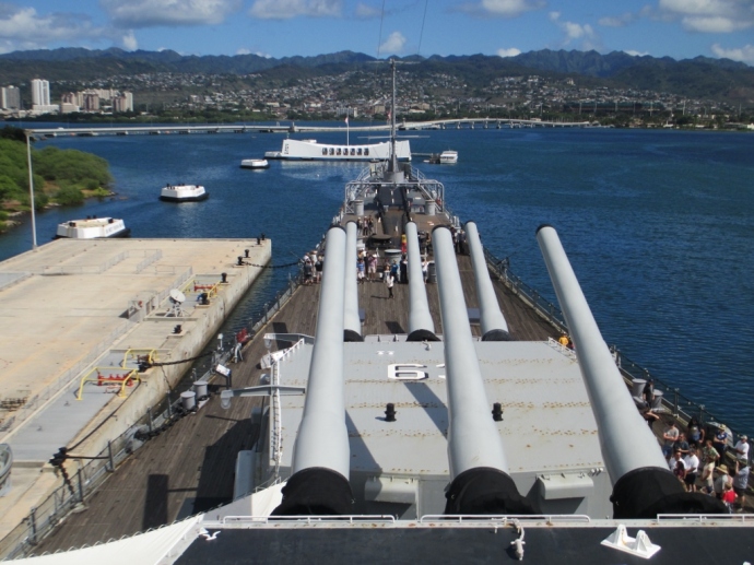 Looking across the mighty guns of the USS Missouri to the USS Arizona Memorial