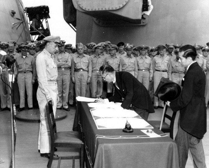  Japanese Foreign Minister Mamoru Shigemitsu signs the Instrument of Surrender on behalf of the Japanese Government onboard USS Missouri September 2nd, 1945 