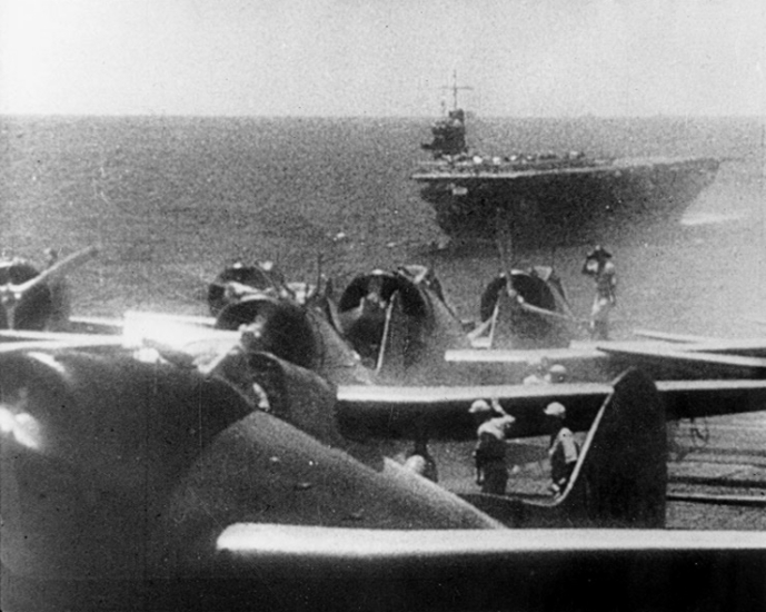 Japanese Val dive bombers prepare to launch for the second wave - the carrier Soryu is in the background